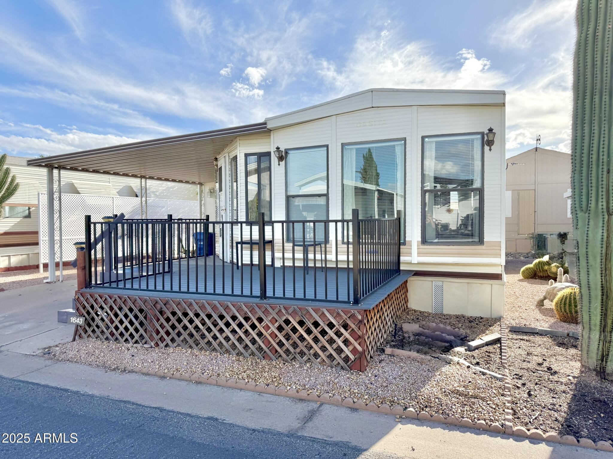 8865 East Baseline Road, Unit 1643 Mesa, AZ 85209 - Photo 25 of 44 a view of a house with a deck