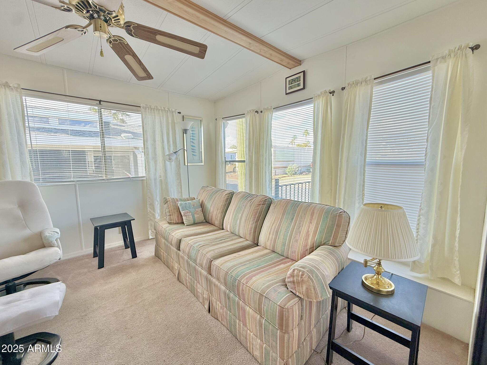 8865 East Baseline Road, Unit 1643 Mesa, AZ 85209 - Photo 6 of 44 a living room with furniture and a window