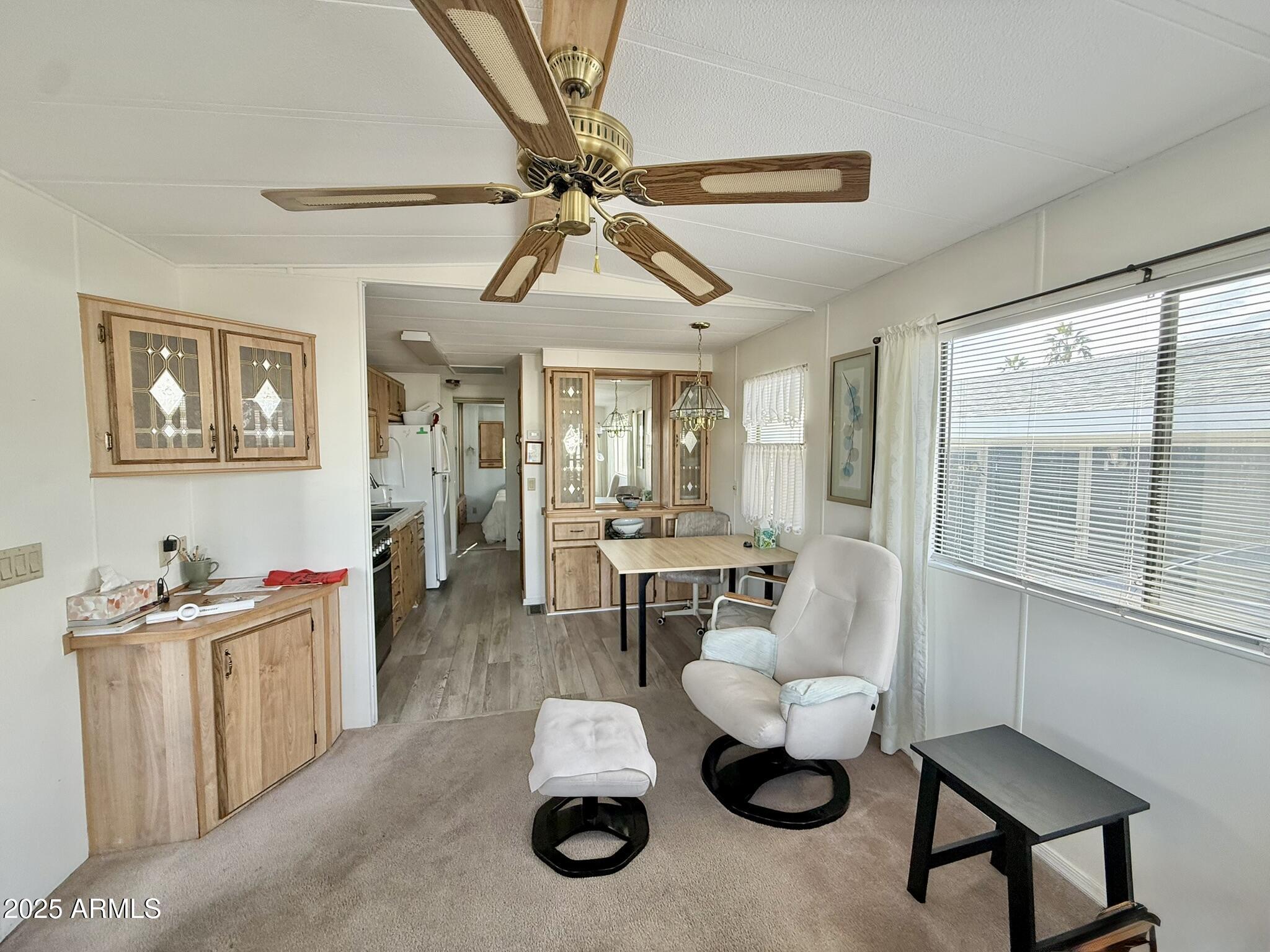 8865 East Baseline Road, Unit 1643 Mesa, AZ 85209 - Photo 8 of 44 a living room with furniture and a large window