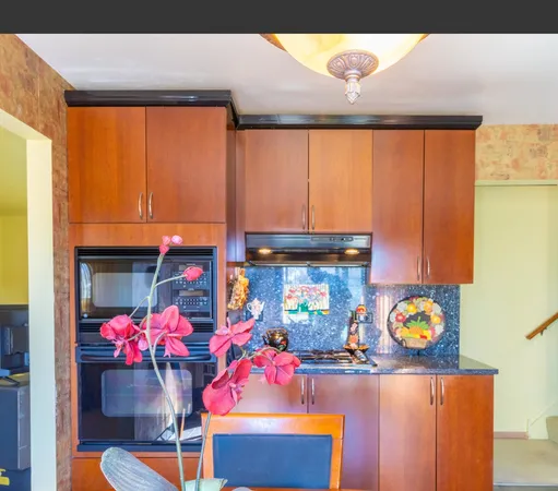 a kitchen with a stove and a microwave