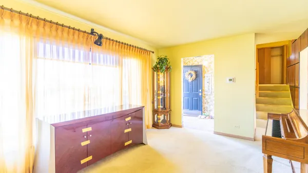 a kitchen with granite countertop a refrigerator and a sink