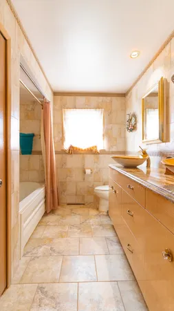 a bathroom with a bathtub and shower