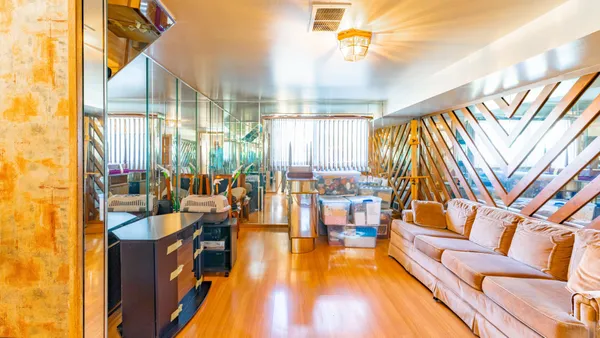 a living room with lots of furniture and a flat screen tv