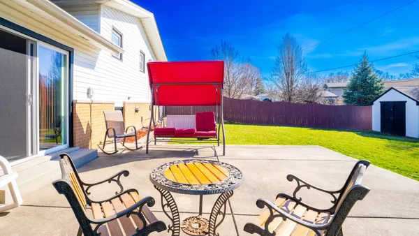 a view of an chairs and tables in the patio