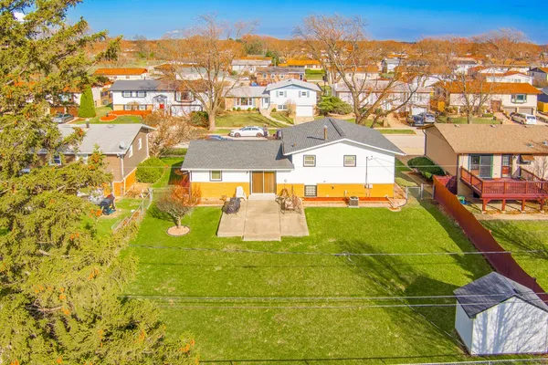 an aerial view of a house with swimming pool