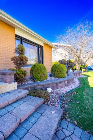 a front view of a house with garden