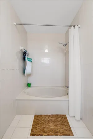 a bathroom with a bath tub
