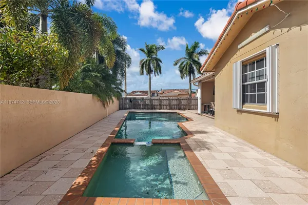 a view of yard with patio