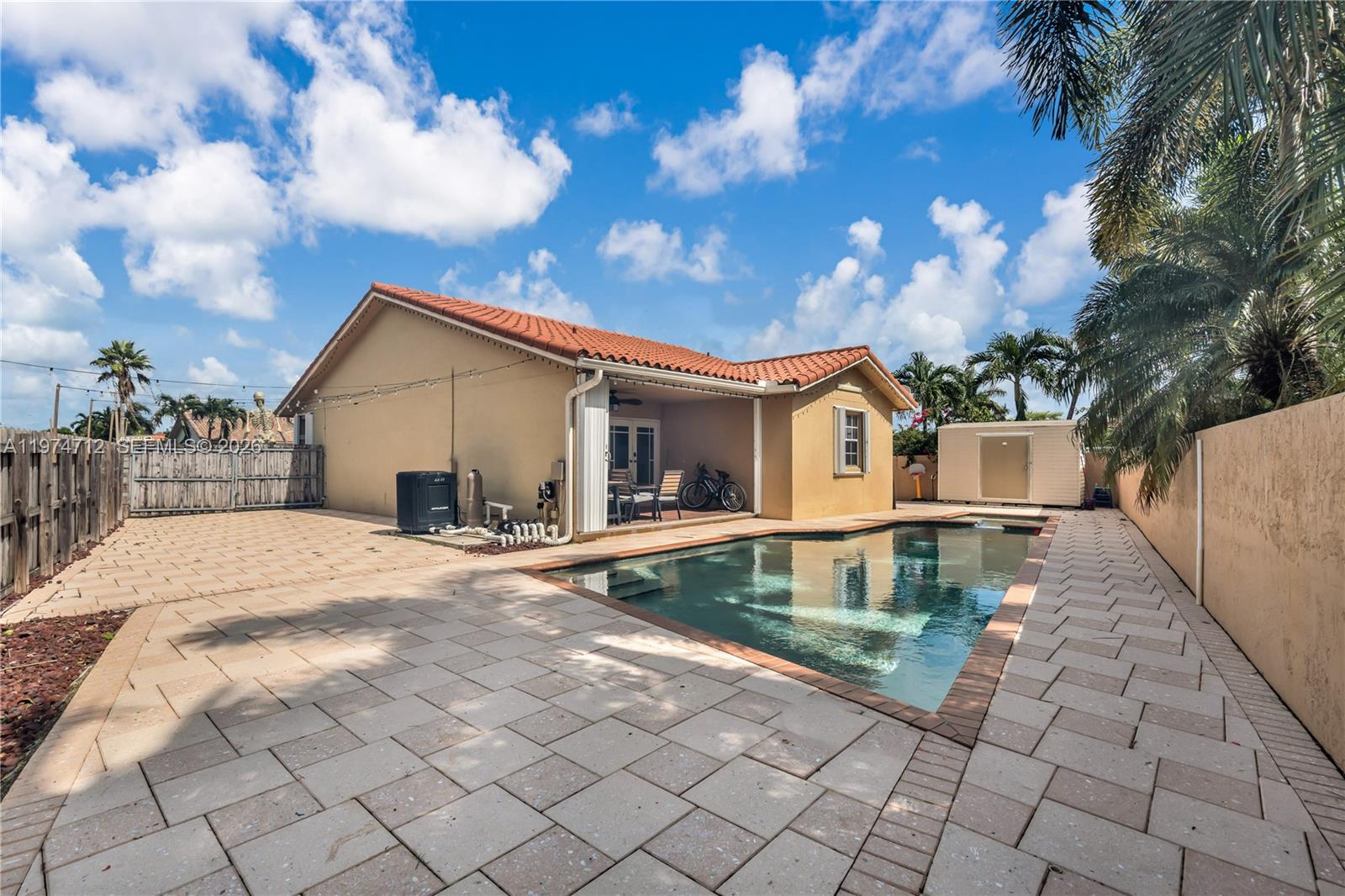 12775 Southwest 59th Street Miami, FL 33183 - Photo 3 of 18 a view of a house with a yard and a large tree