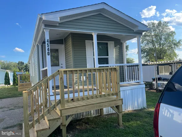 a view of a chair and table in the deck