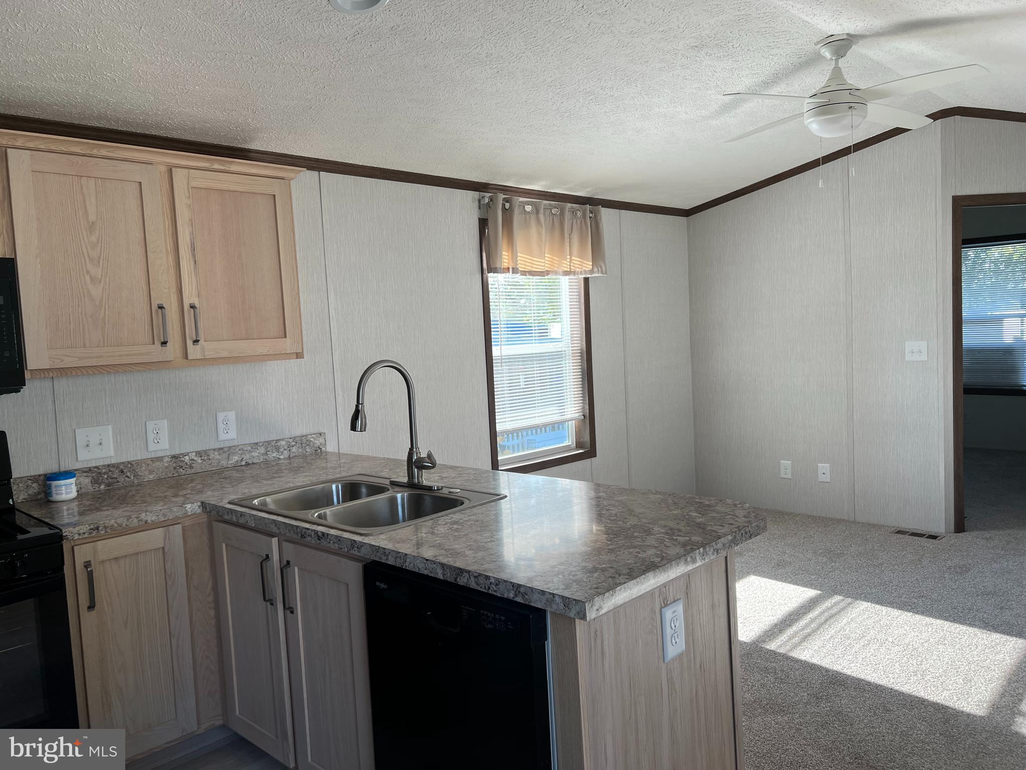 4540 Rolo Court Mechanicsburg, PA 17055 - Photo 2 of 11 a view of a kitchen with sink and mirror