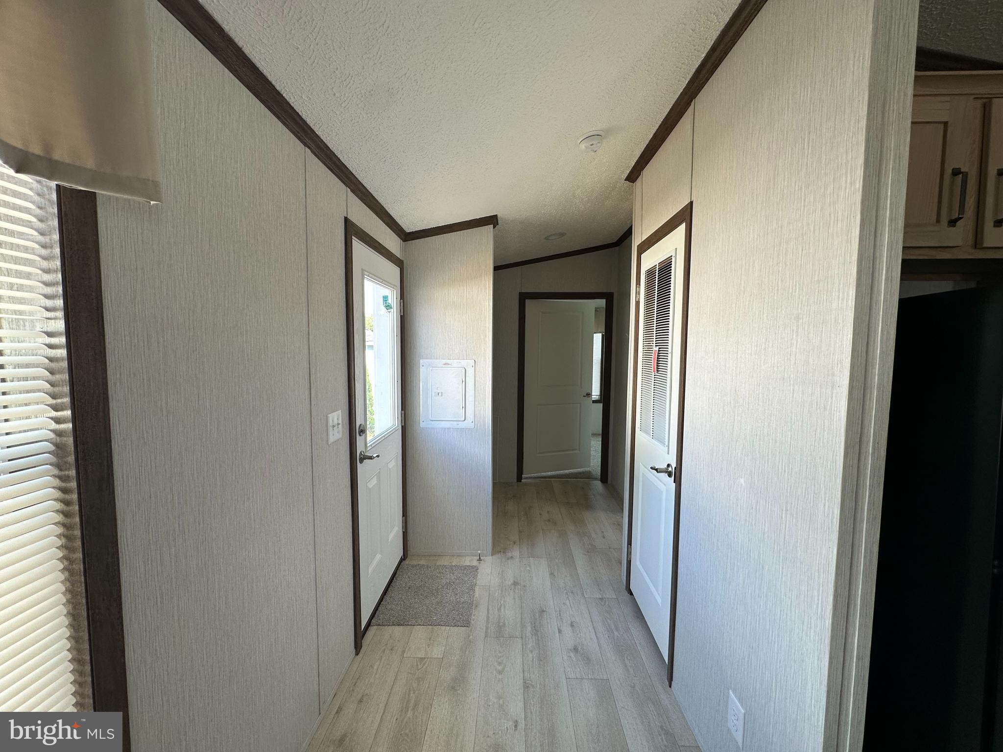 4540 Rolo Court Mechanicsburg, PA 17055 - Photo 5 of 11 a view of a hallway with wooden floor and staircase