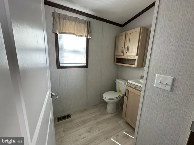 a bathroom with a toilet sink and tub