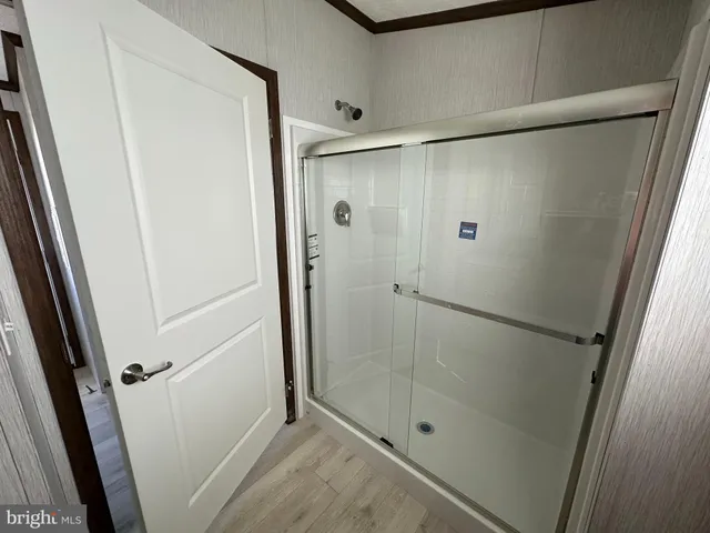 a bathroom with a glass door shower