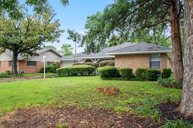 a house view with a garden space