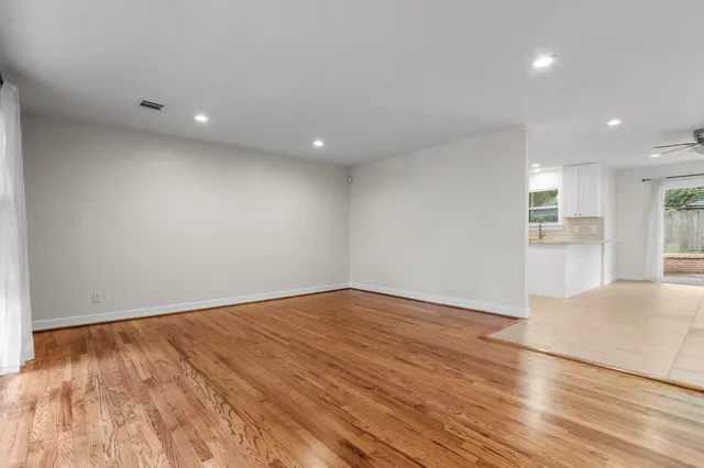 a view of a kitchen with microwave and cabinets