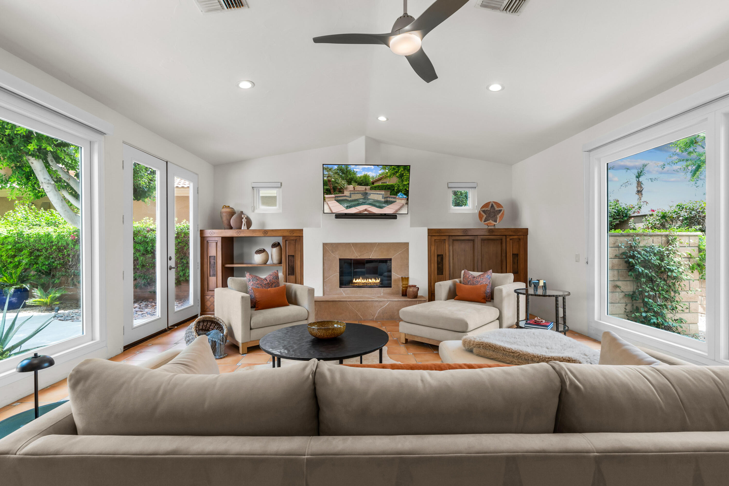 78900 Rio Seco La Quinta, CA 92253 - Photo 19 of 48 a living room with furniture a fireplace and a large window
