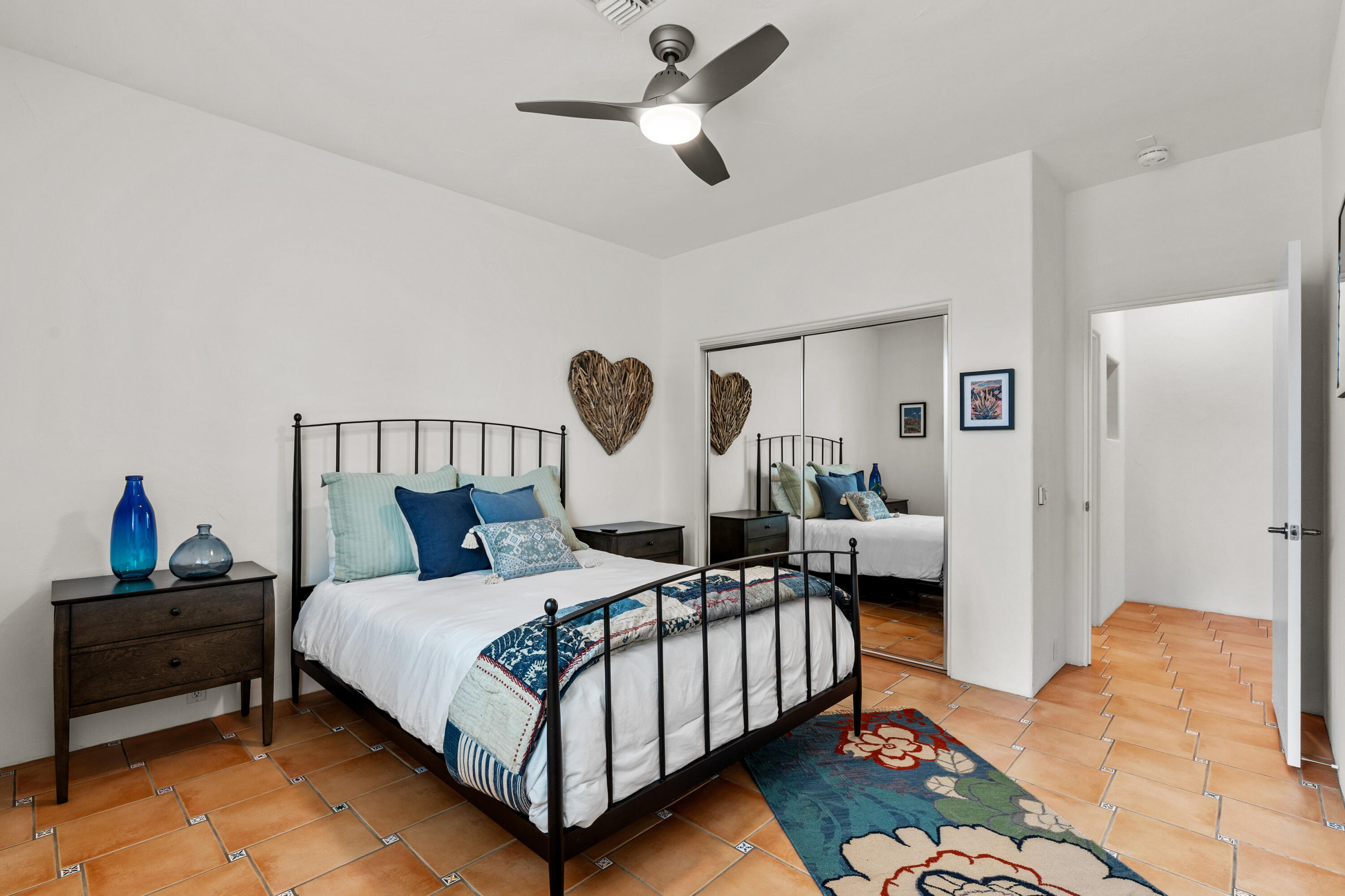 78900 Rio Seco La Quinta, CA 92253 - Photo 27 of 48 a bedroom with a bed and a chandelier