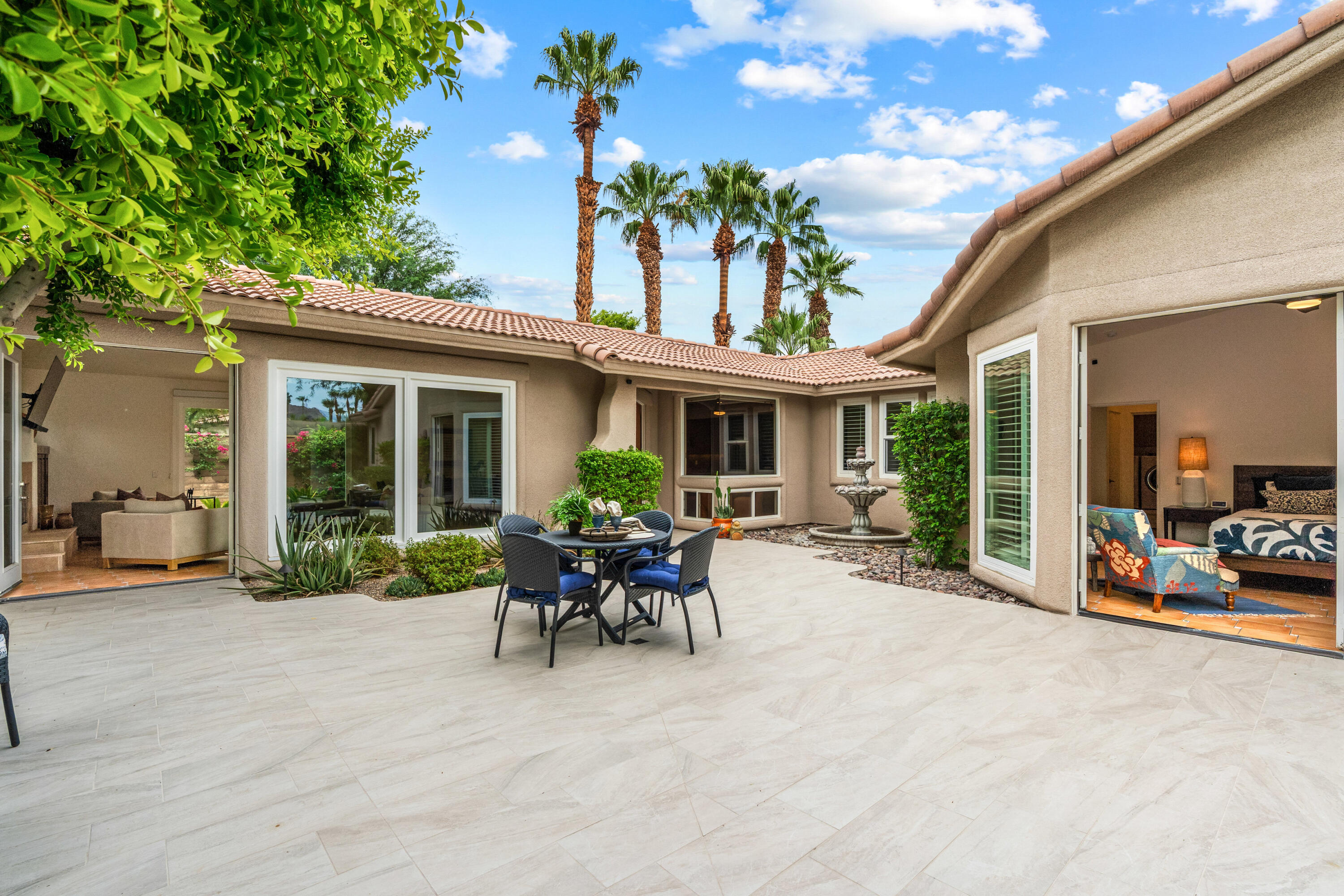 78900 Rio Seco La Quinta, CA 92253 - Photo 33 of 48 a view of a house with sitting area and garden