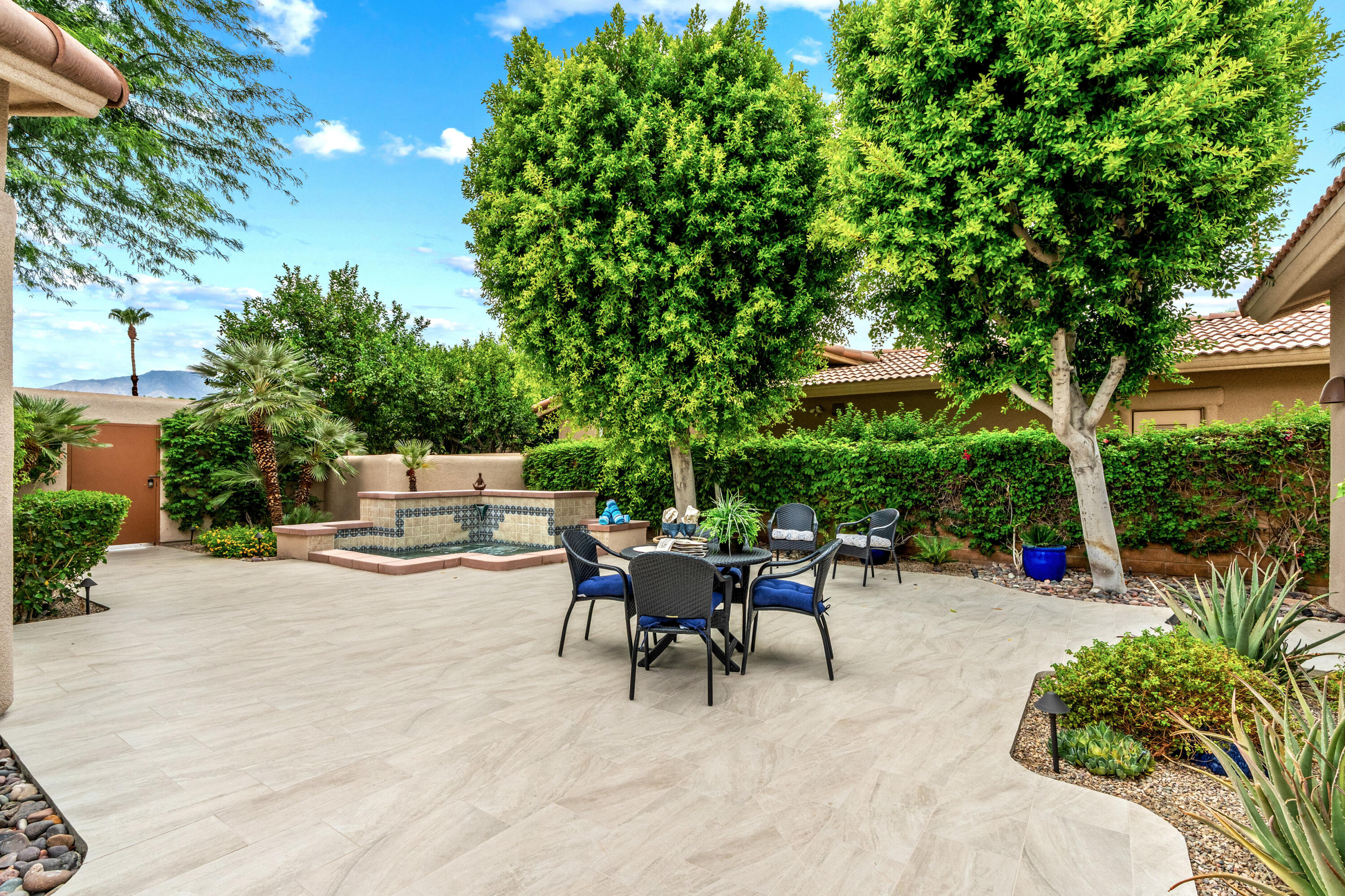 78900 Rio Seco La Quinta, CA 92253 - Photo 37 of 48 a backyard of a house with table and chairs