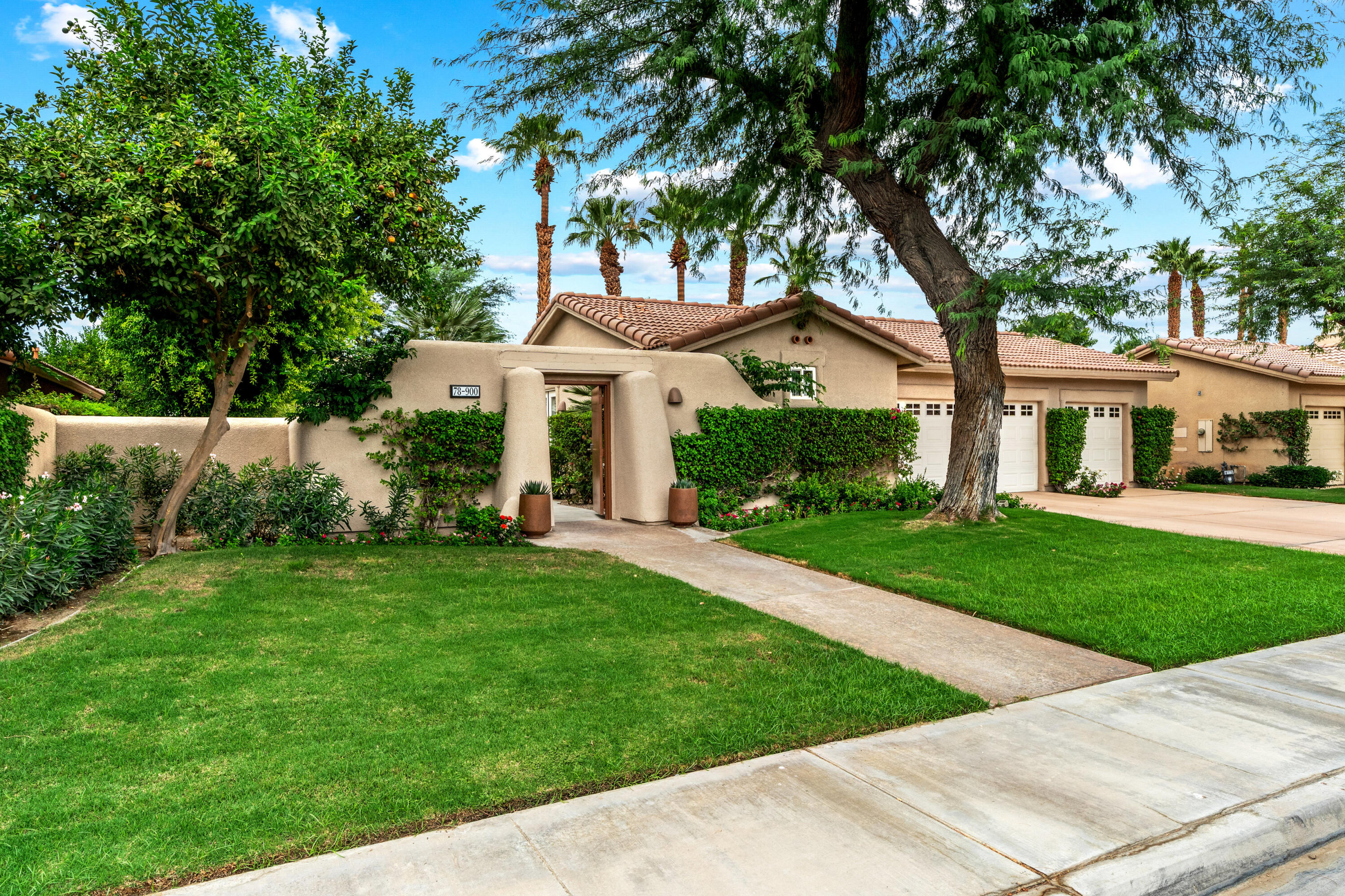 78900 Rio Seco La Quinta, CA 92253 - Photo 40 of 48 front view of a house with a yard