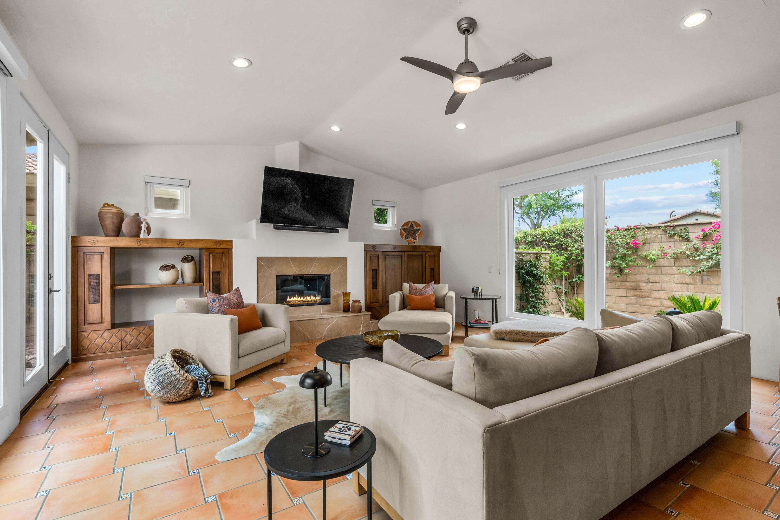 78900 Rio Seco La Quinta, CA 92253 - Photo 4 of 48 a living room with furniture fireplace and a flat screen tv