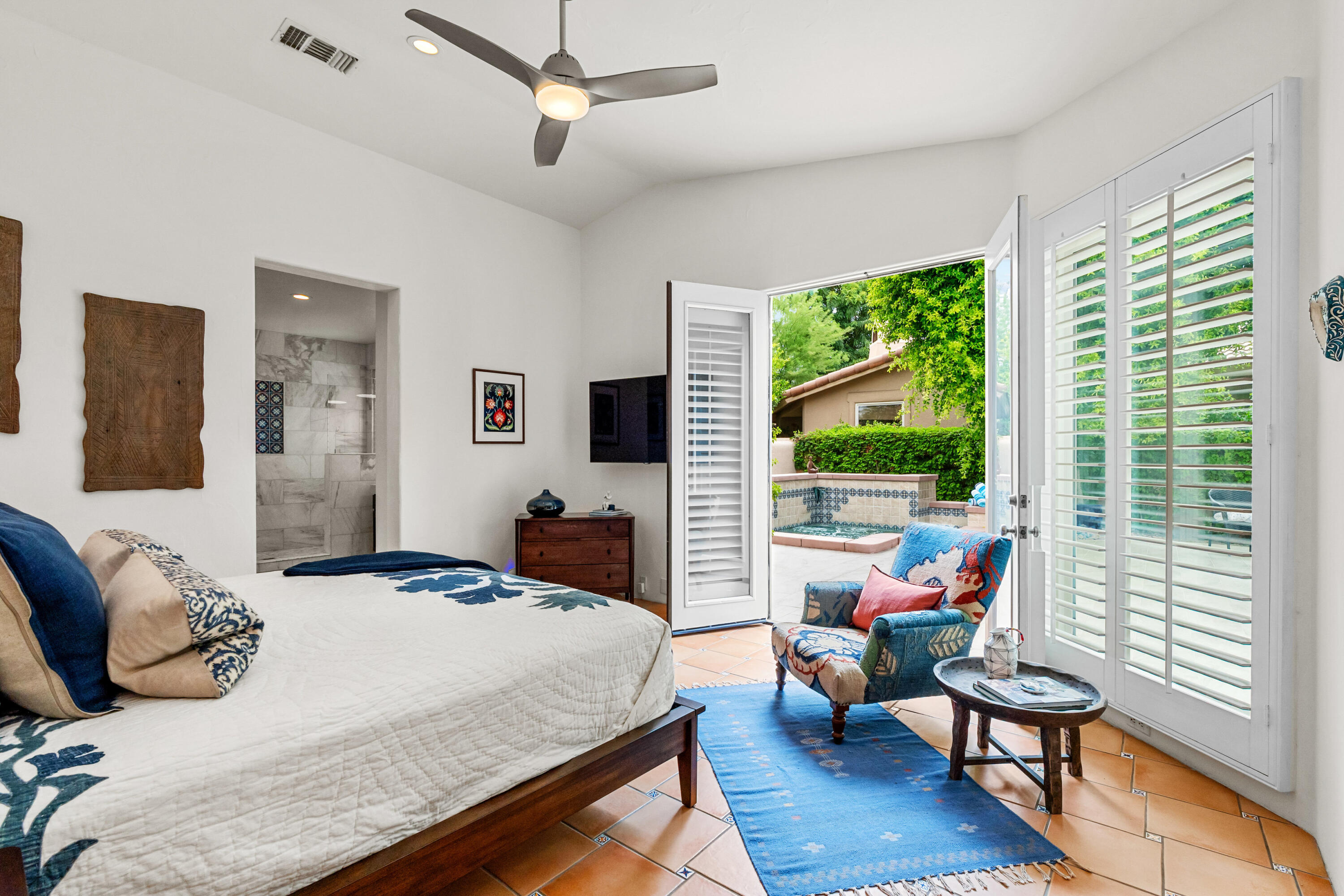 78900 Rio Seco La Quinta, CA 92253 - Photo 5 of 48 a bedroom with a bed and large windows