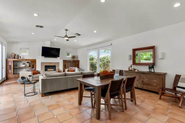 a view of a workspace with furniture and a fireplace