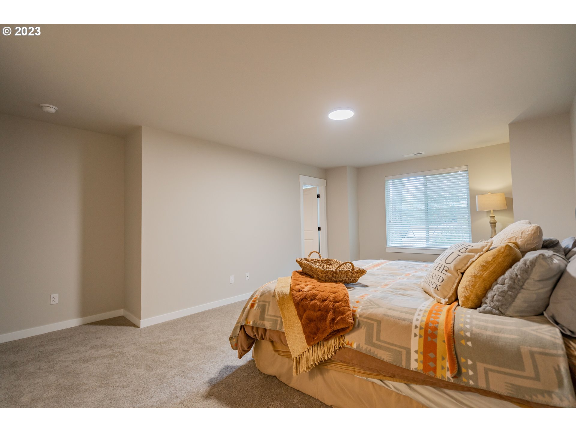 7049 South 13th Street Ridgefield, WA 98642 - Photo 3 of 33 a bedroom with furniture and a bed