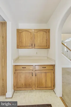 a view of a kitchen with wooden floor and cabinet