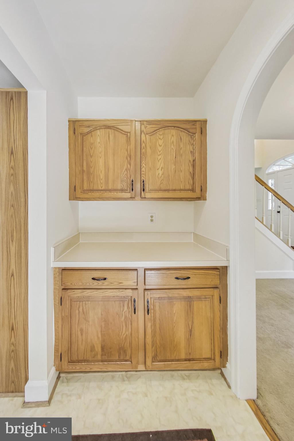 6104 Cool Spring Terrace South Frederick, MD 21701 - Photo 13 of 67 a view of a kitchen with wooden floor and cabinet