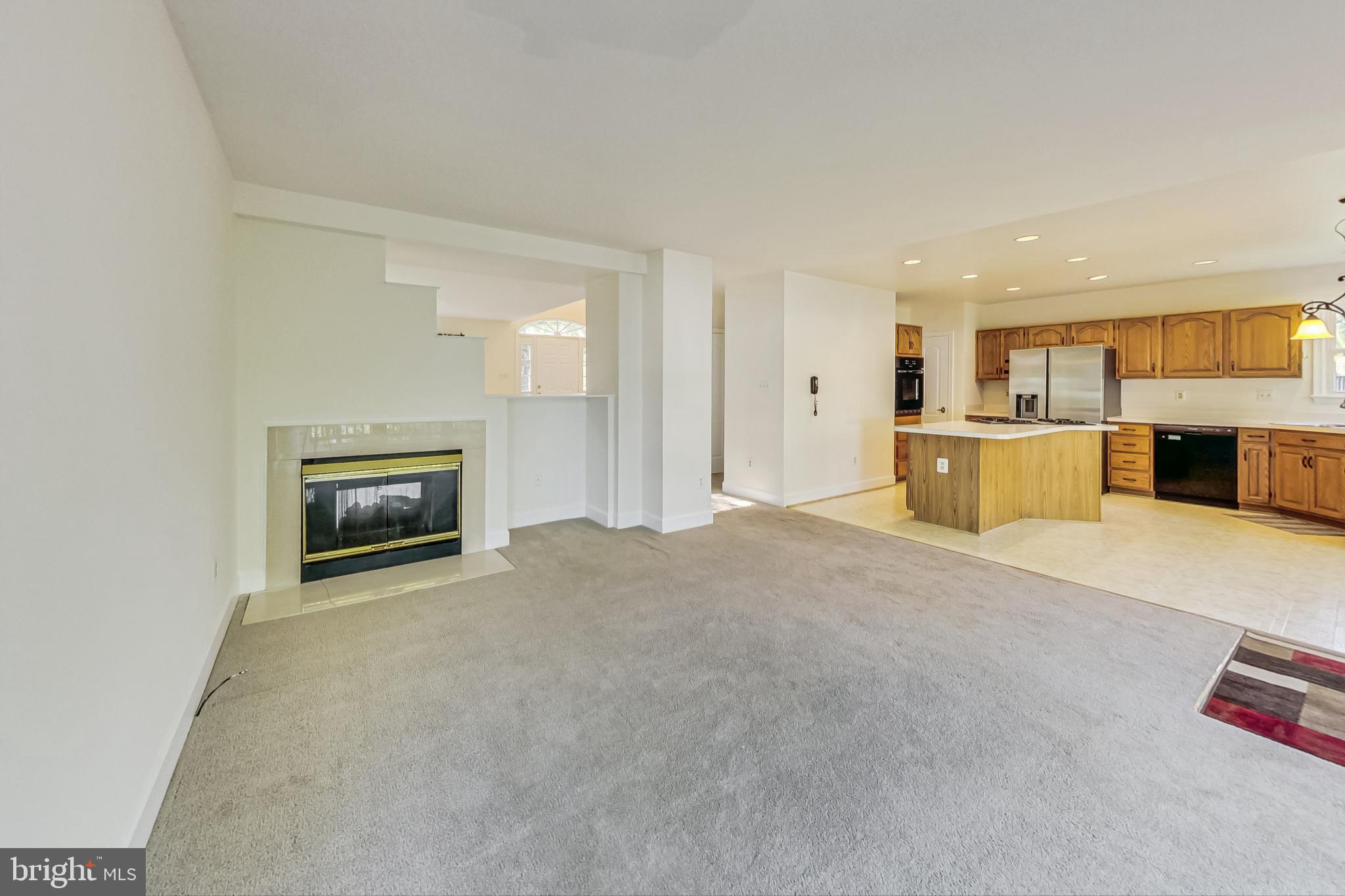 6104 Cool Spring Terrace South Frederick, MD 21701 - Photo 15 of 67 a view of a kitchen with a sink and a fireplace