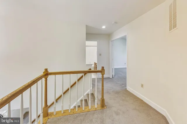 a spacious bathroom with a tub sink and mirror