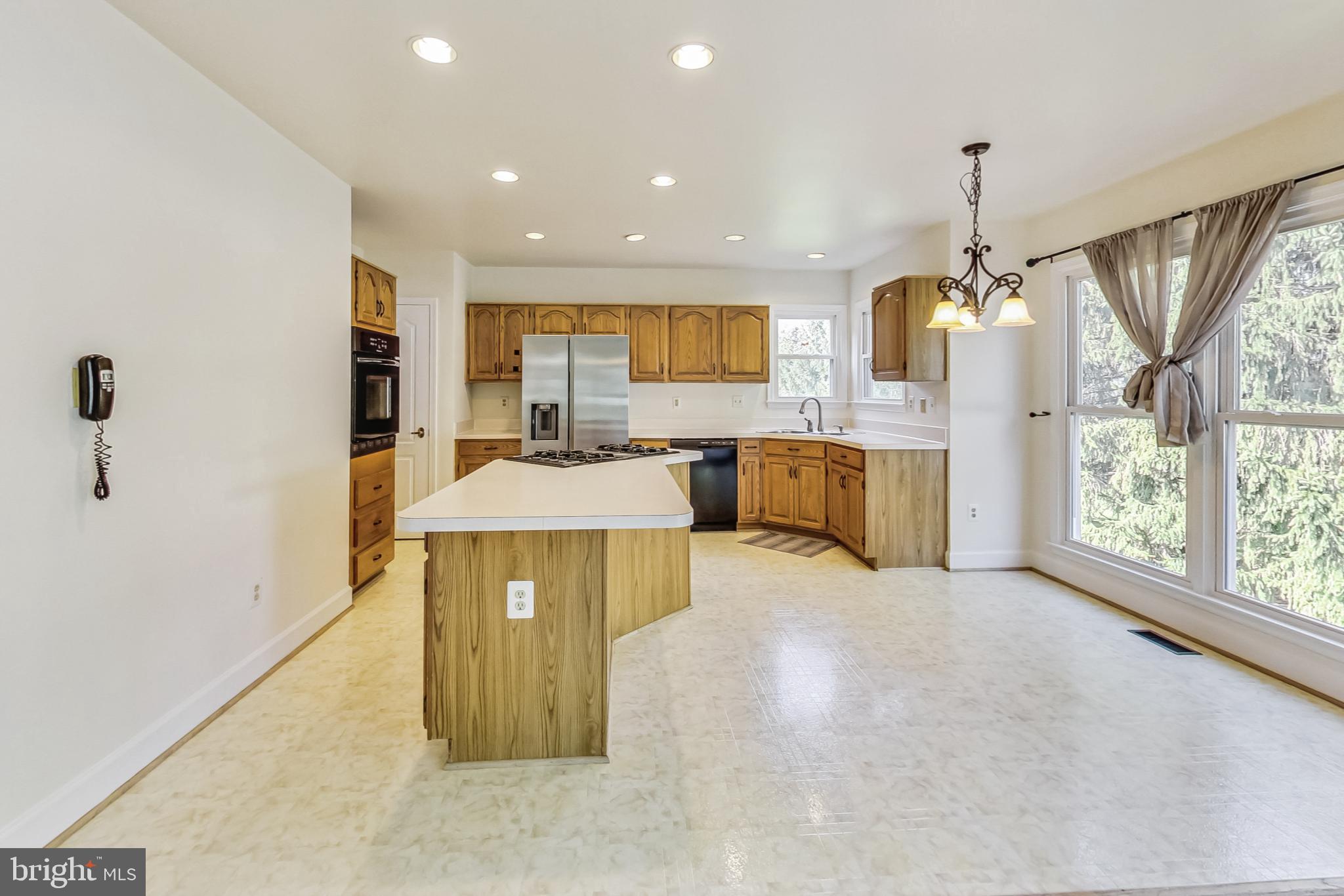 6104 Cool Spring Terrace South Frederick, MD 21701 - Photo 3 of 67 a spacious bathroom with a tub sink and mirror