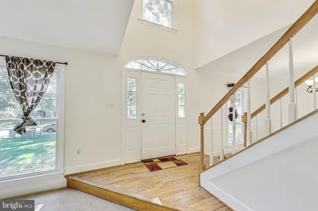 a view of an entryway with wooden floor