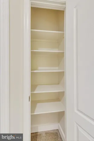 a front view of a house with yard and staircase