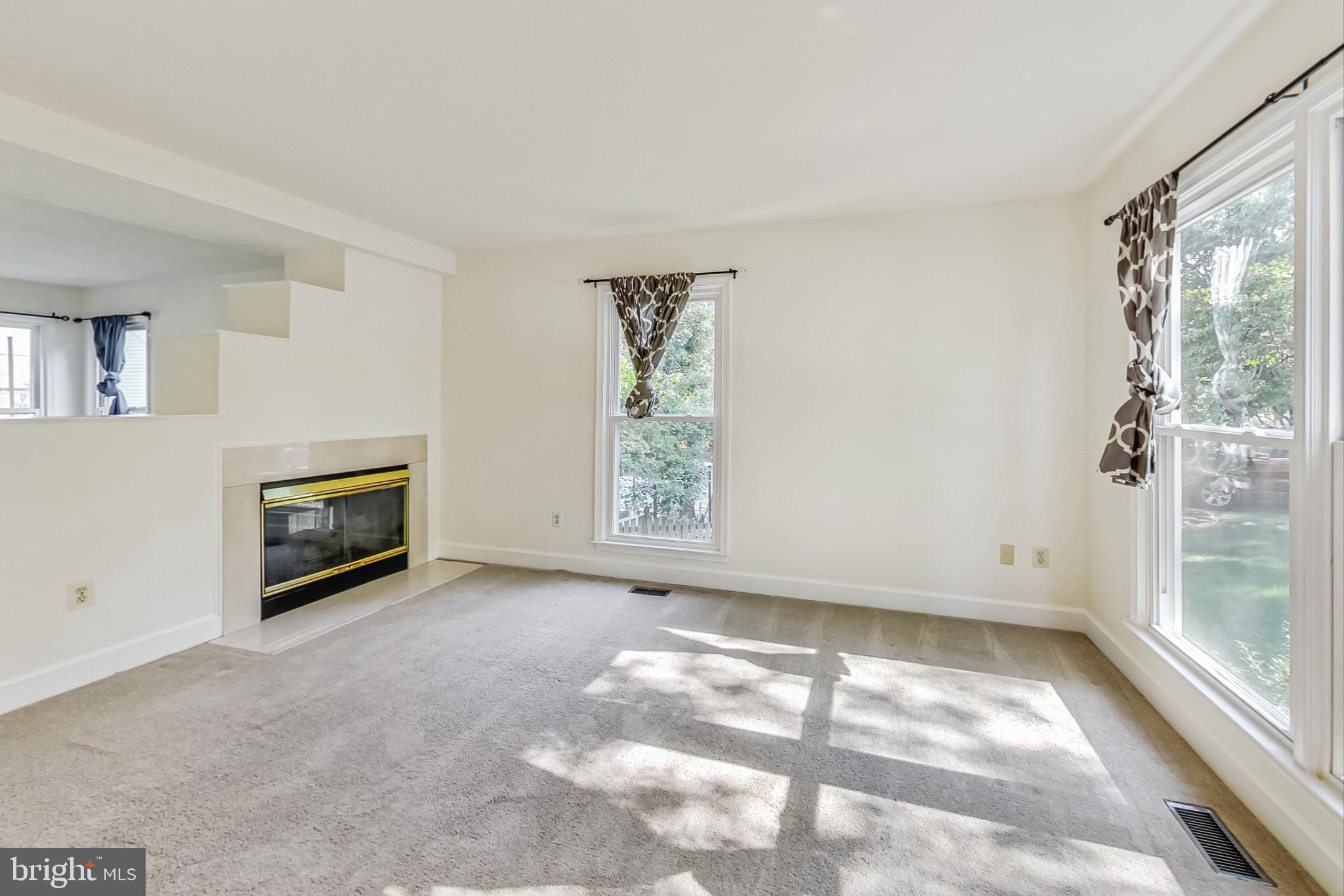 6104 Cool Spring Terrace South Frederick, MD 21701 - Photo 5 of 67 a view of a big room with windows and a fireplace