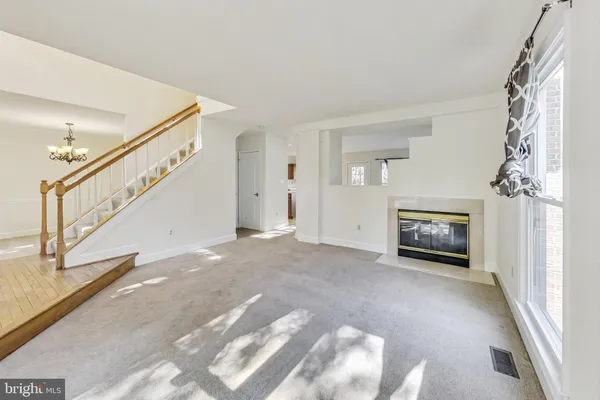 a view of an empty room and fire place