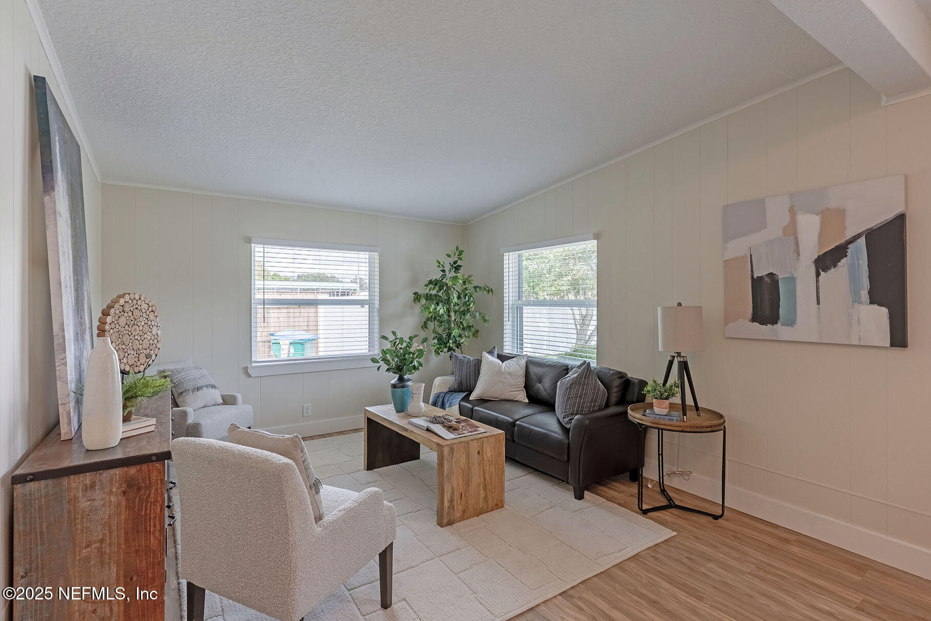 571 Hopkins Street Neptune Beach, FL 32266 - Photo 18 of 63 a living room with furniture and a window
