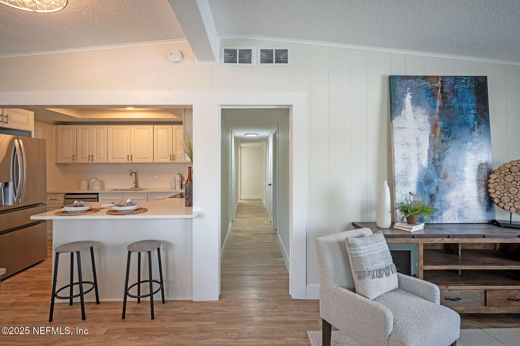 571 Hopkins Street Neptune Beach, FL 32266 - Photo 22 of 63 a living room with furniture and a table