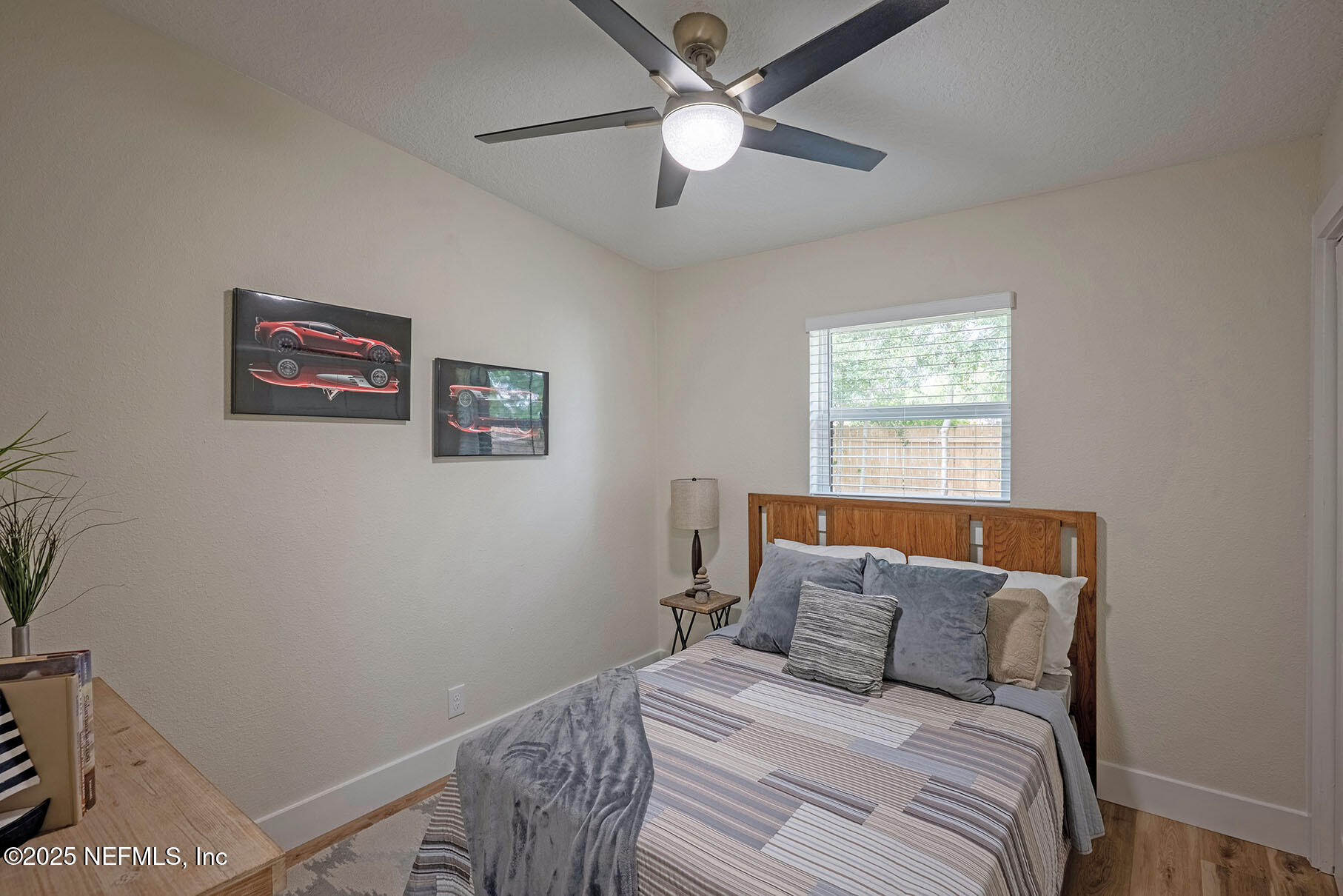 571 Hopkins Street Neptune Beach, FL 32266 - Photo 25 of 63 a bedroom with a bed and a window
