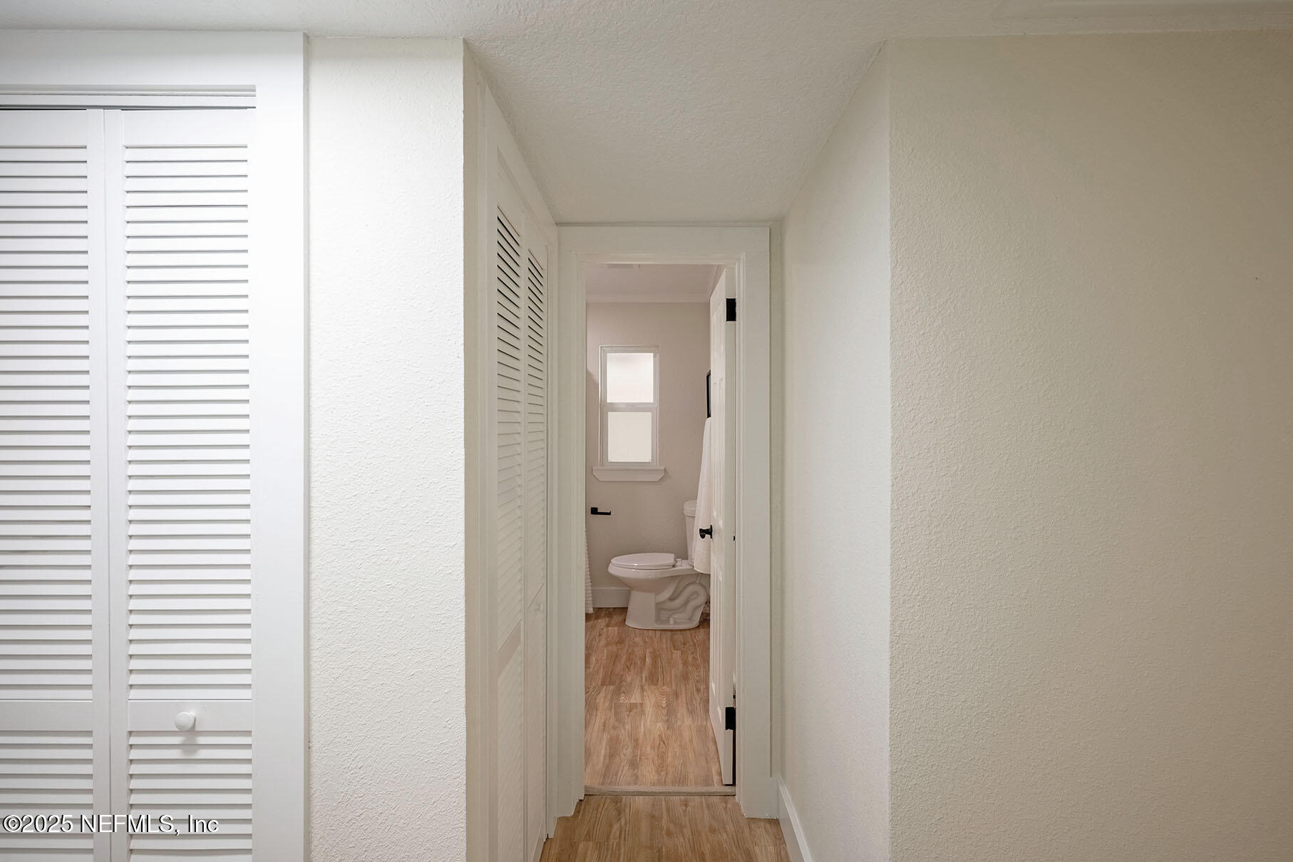 571 Hopkins Street Neptune Beach, FL 32266 - Photo 28 of 63 a view of a bathroom from a hallway