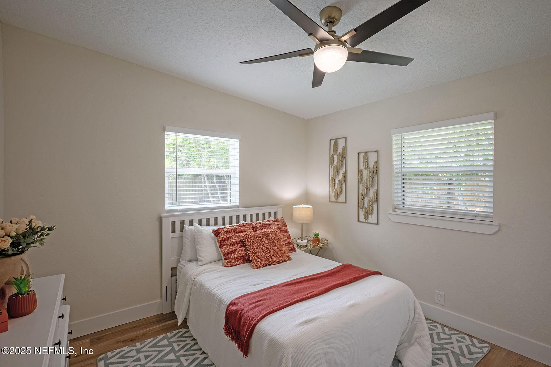 571 Hopkins Street Neptune Beach, FL 32266 - Photo 32 of 63 a bedroom with a bed and a window