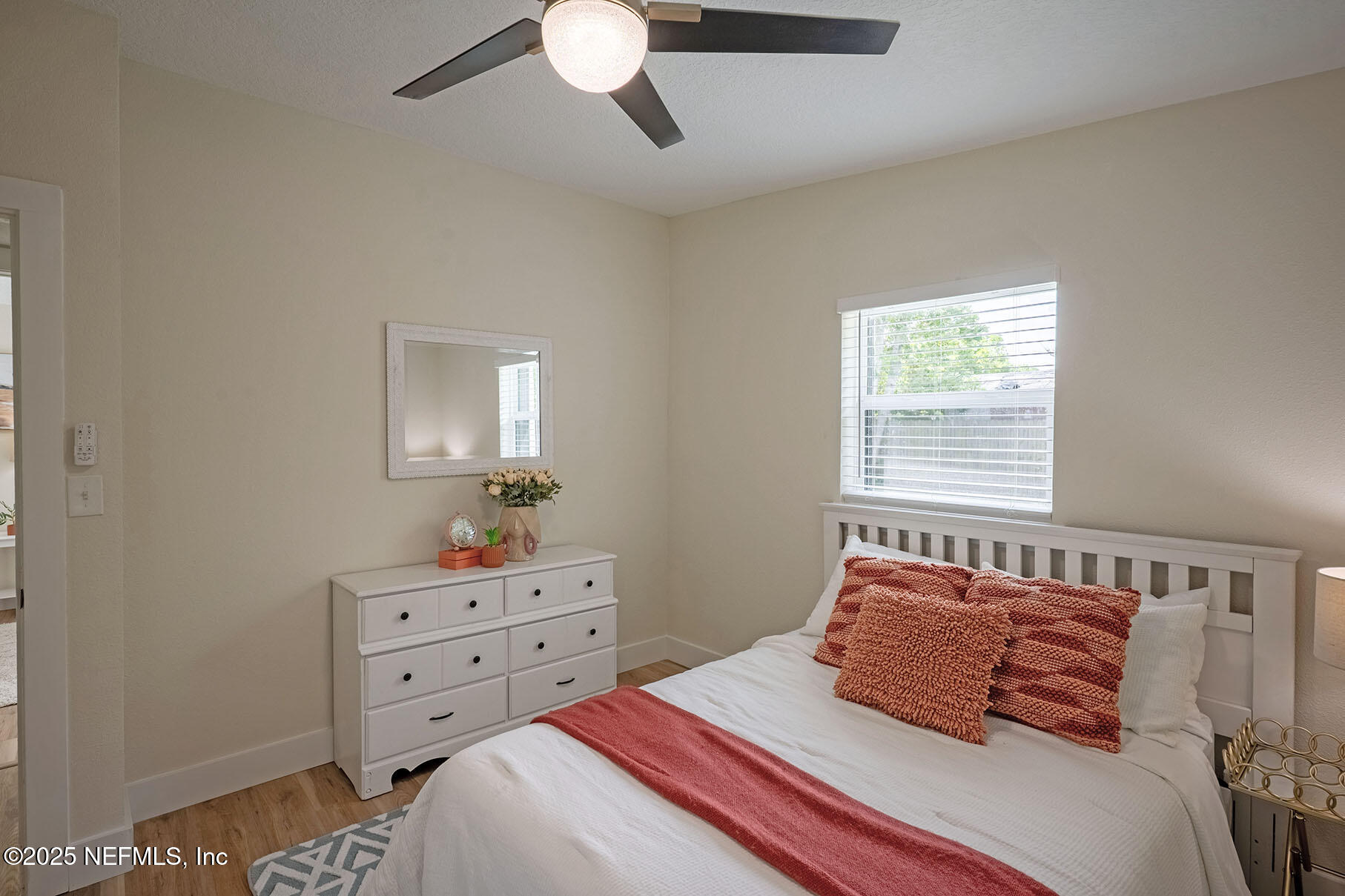 571 Hopkins Street Neptune Beach, FL 32266 - Photo 33 of 63 a bedroom with a bed and a dresser