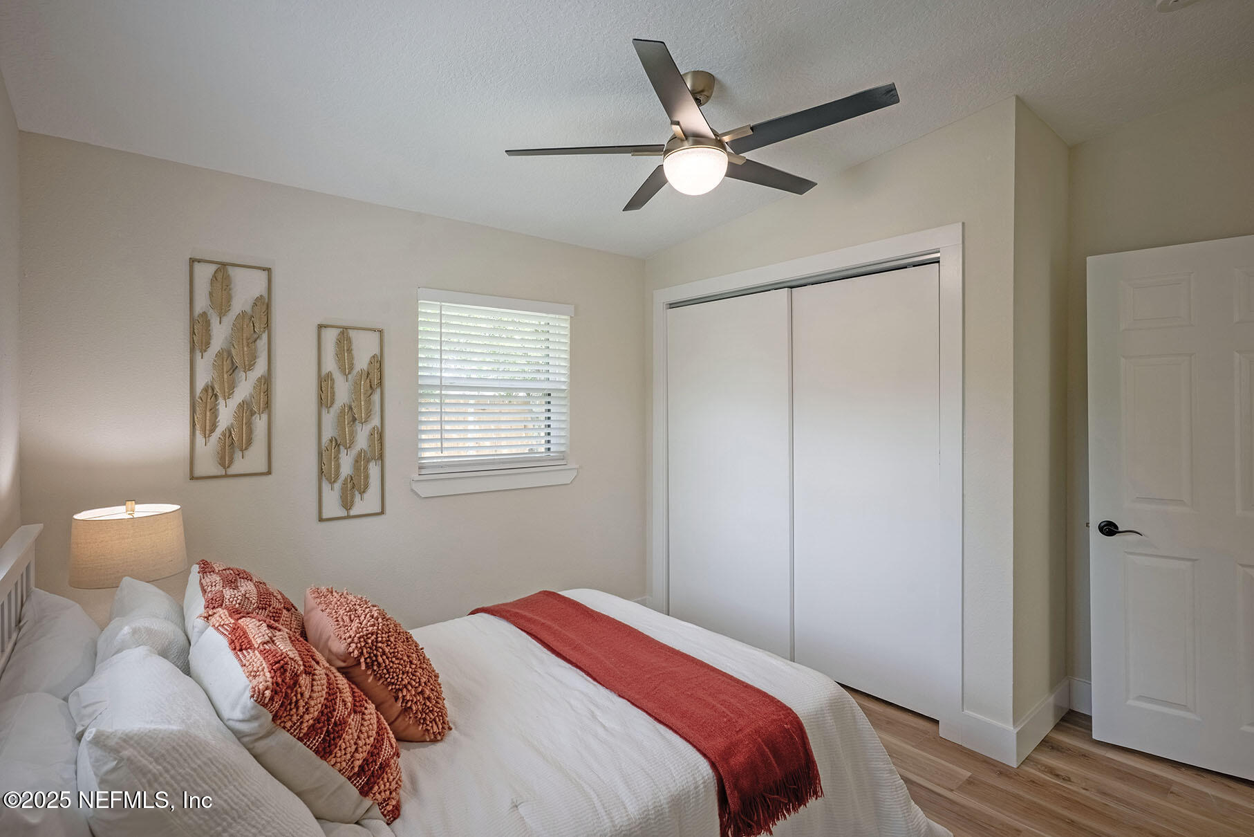 571 Hopkins Street Neptune Beach, FL 32266 - Photo 34 of 63 a bedroom with a bed and a window