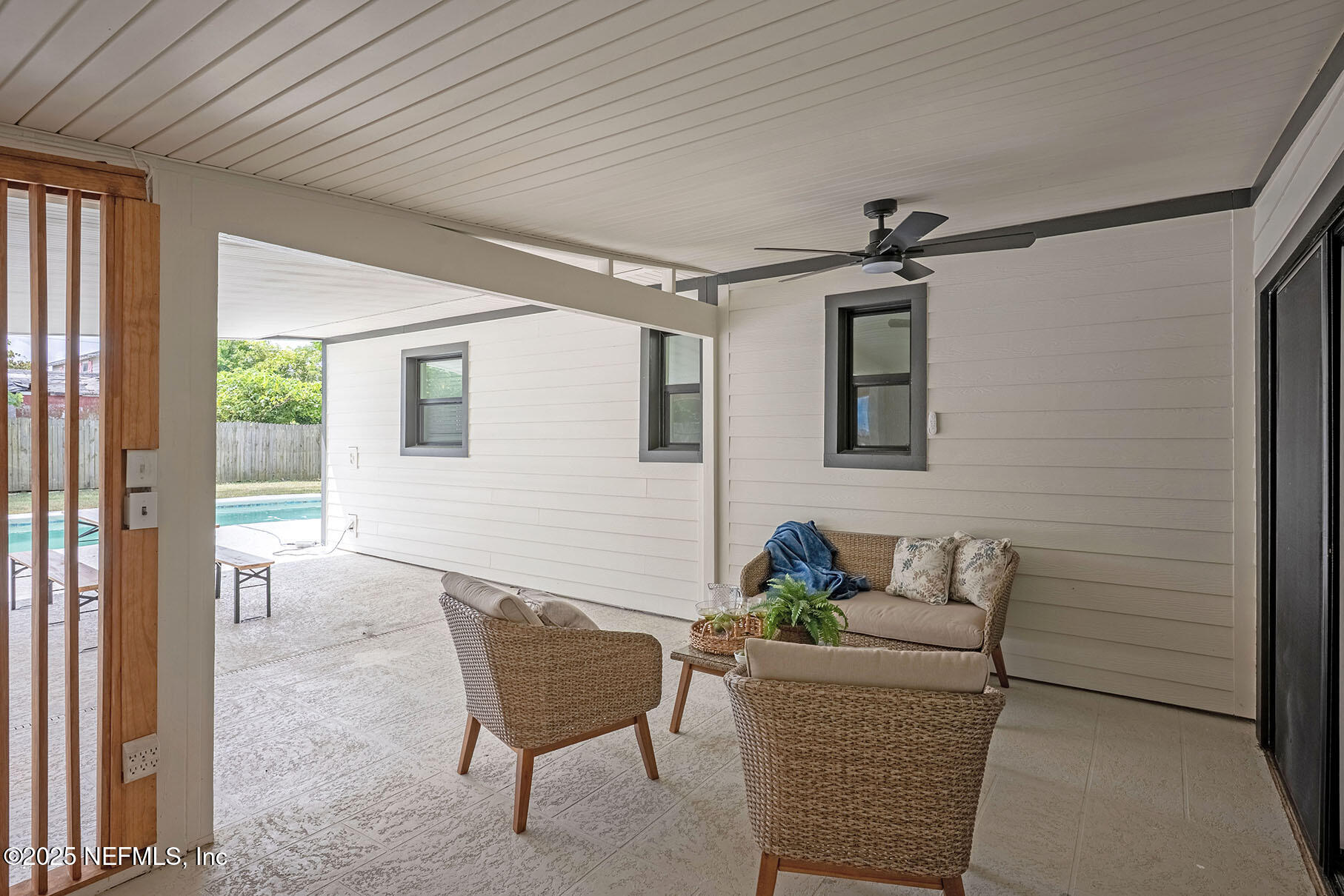 571 Hopkins Street Neptune Beach, FL 32266 - Photo 45 of 63 a living room with furniture and a window