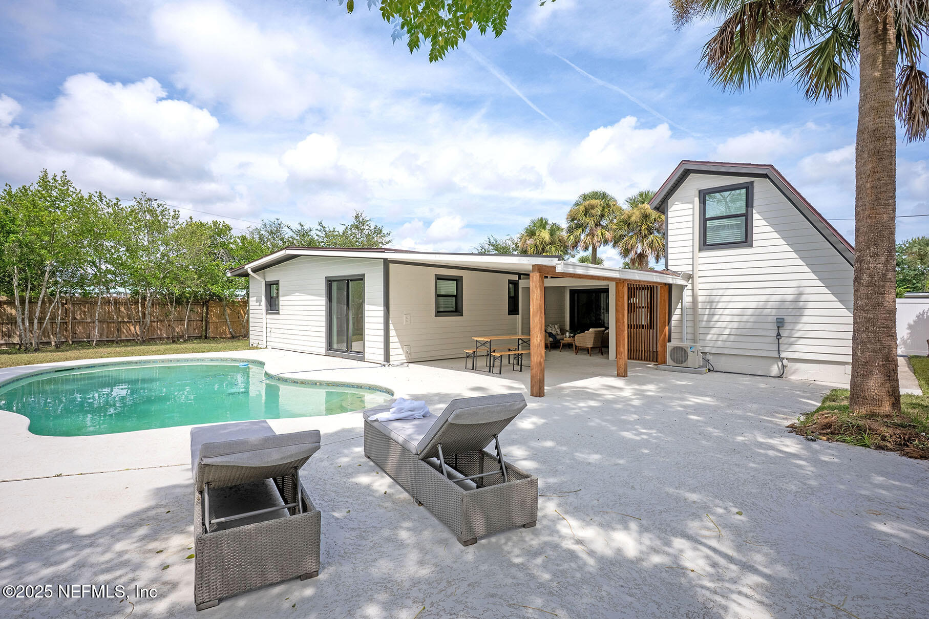 571 Hopkins Street Neptune Beach, FL 32266 - Photo 48 of 63 a view of a backyard with furniture and garden