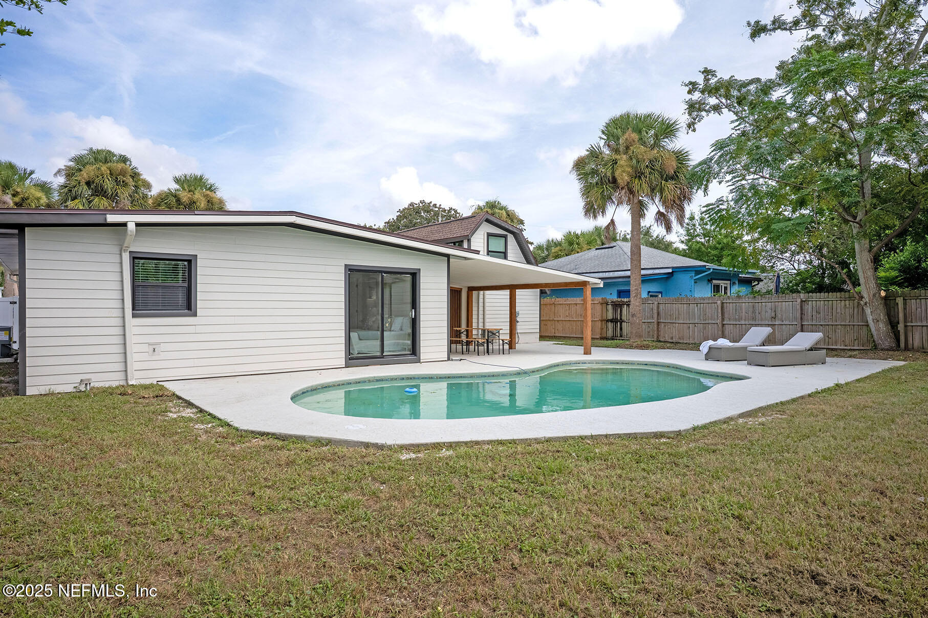 571 Hopkins Street Neptune Beach, FL 32266 - Photo 52 of 63 a front view of a house with a yard
