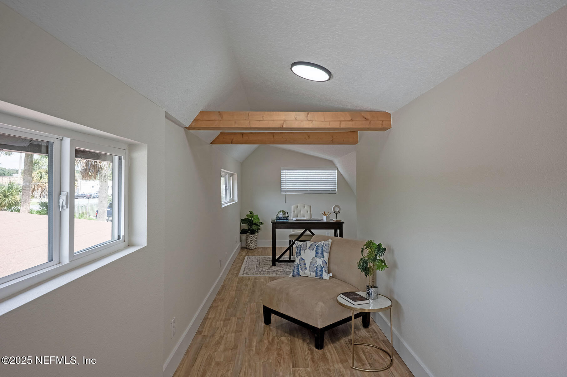571 Hopkins Street Neptune Beach, FL 32266 - Photo 57 of 63 a living room with furniture and a window