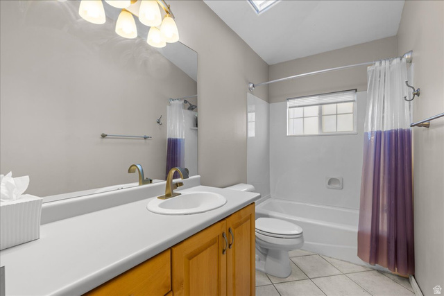 7824 South Sequoia Tree Lane Sandy, UT 84094 - Photo 24 of 43 Bathroom with vanity, shower / tub combo, light tile patterned flooring, a skylight, and a chandelier